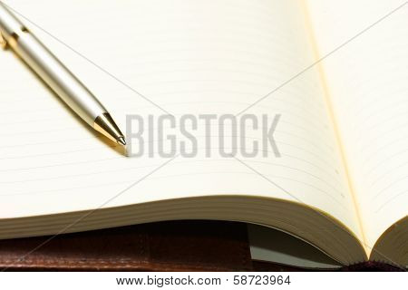 pen and open notepad