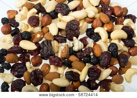 mixed nuts and dried fruits isolated on white background