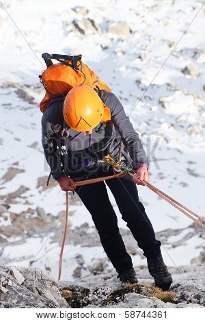 Alpinist climbing ferrata La torre di Toblin (2.617 m), Dolomites, Italy, Europe