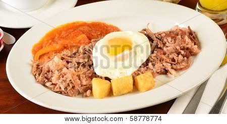 Fried eggs on rice and beans.