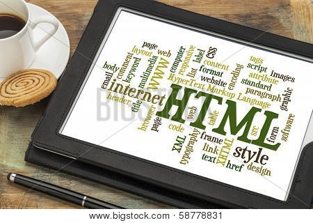 html (hypertext markup language) word cloud on a digital tablet with a cup of coffee