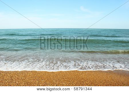 Pebble beach and sea wave