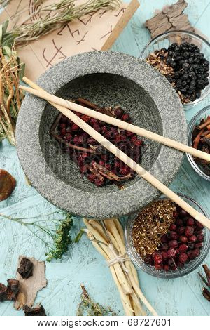 Traditional chinese herbal medicine ingredients with not real hieroglyphs, close-up