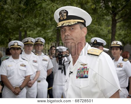 NEW YORK - MAY 23, 2014: A portrait of Rear Admiral Scott A. Stearney standing in front of US Navy officers during the re-enlistment and promotion ceremony at the National September 11 Memorial site.