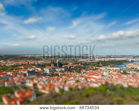 Aerial view of Hradchany part of Prague: the Saint Vitus Cathedral and Prague Castle, view from Petrin Observation Tower with tilt shift toy effect shallow depth of field. Prague, Czech Republic