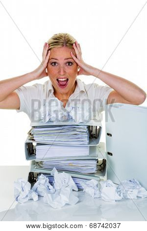 young woman in office is overwhelmed with work. burnout in work or study.