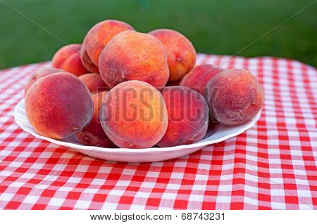 Ripe Peaches On A Plate