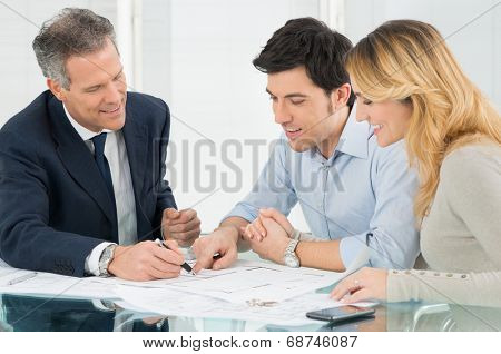 Happy Couple Looking Blueprint About New House 