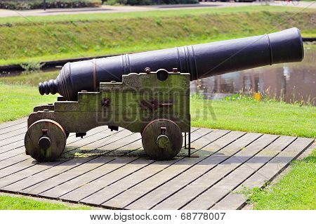 Historic Cannon Stands Ready At The Canal