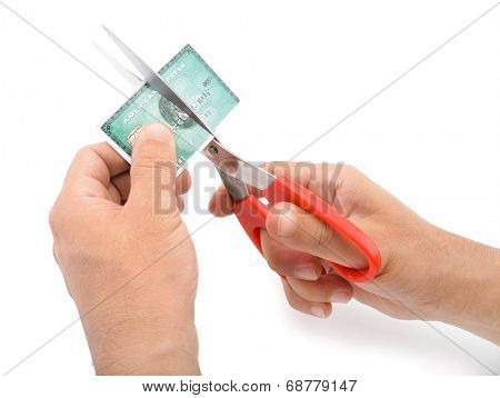 Ankara, Turkey - October 17, 2012 : Studio shot of male hands cutting American Express credit card isolated on white background. 