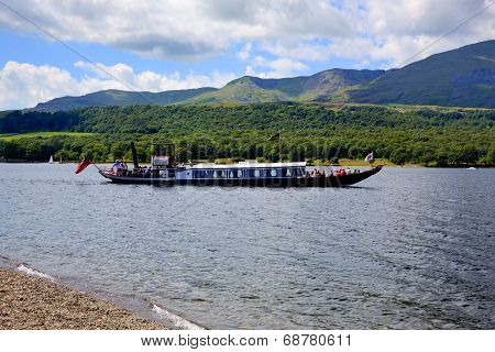 Holidaymakers on a Gondola steam boat on Coniston water Lake District England uk on a summer day