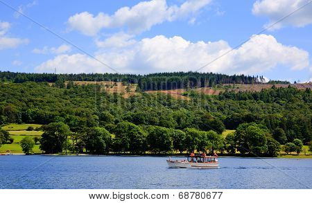 Pleasure boat Coniston water Lake District England uk on a beautiful blue sky summer day