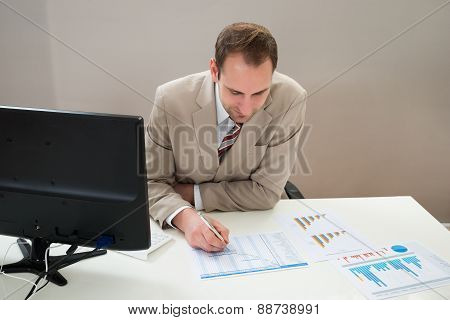 Businessman Making Gantt Diagram In Office