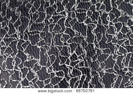 metal gird decoration on black background- closeup photo