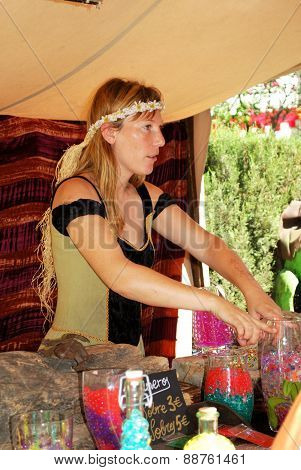 Woman selling glass beads, Barbate.