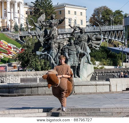 Ukraine, Kiev - September 10,2013: Young man in suit animator working for the tourists at the Indepe