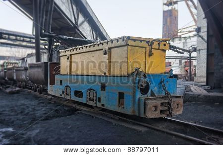 Train In National Colors With Trolleys In A Coal Mine. Donbass, Ukraine