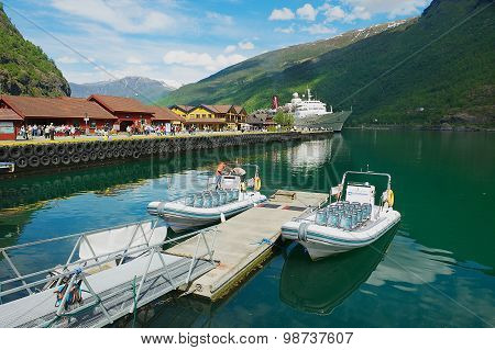 View to boats tied at the Flam railway station pier in Flam, Norway.