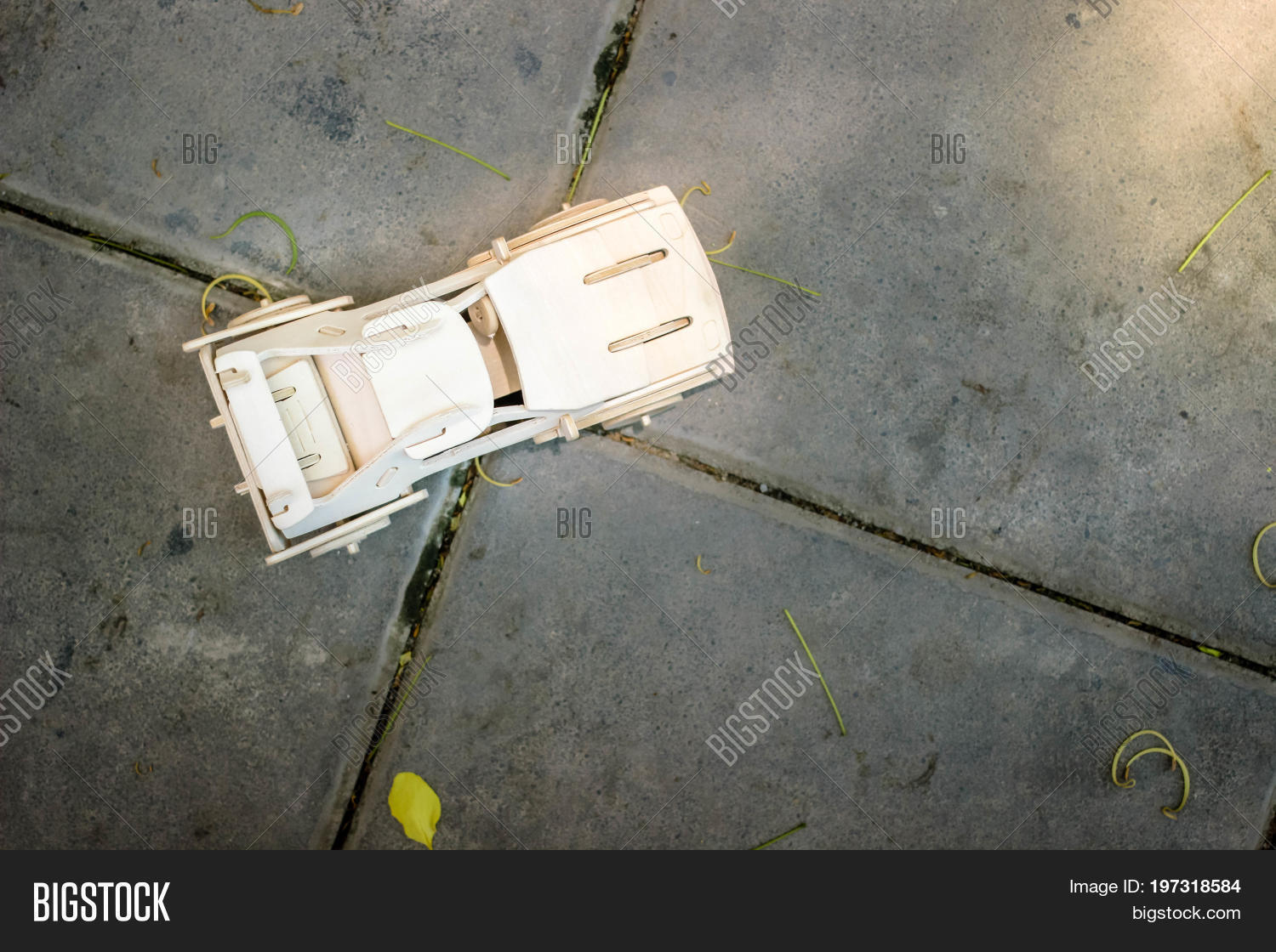 Top View Of Wooden Car Model On Cement Floor Top View Of Wooden Car Model On Cement Floor