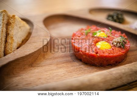 Boeuf a la tartar. Made from hand-chopped internal beef fillet served with raw egg and croutons.