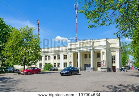 POLOTSK BELARUS - MAY 19 2017: Unknown people walk along street near cinema 