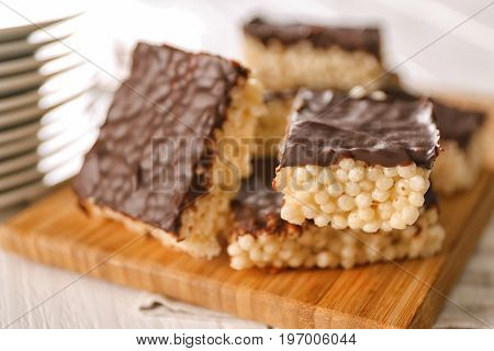 Cutting board with delicious rice treats, closeup