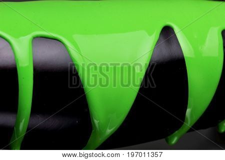 Pouring Green Paint Over Black Background, Macro Closeup.texture.abstract