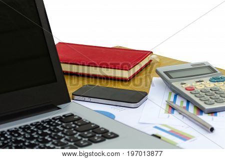 close up business accessories laptop calculator datasheet pen notebook and smartphone on desk isolated on white background financial report saving and economy business concept selective focus