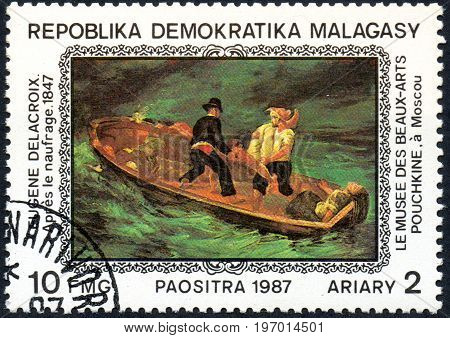 UKRAINE - CIRCA 2017: A postage stamp printed in Madagascar shows Eugene Delacroix: After the Shipwreck 1847 from series Paintings from Pushkin-Museum Moscow circa 1987