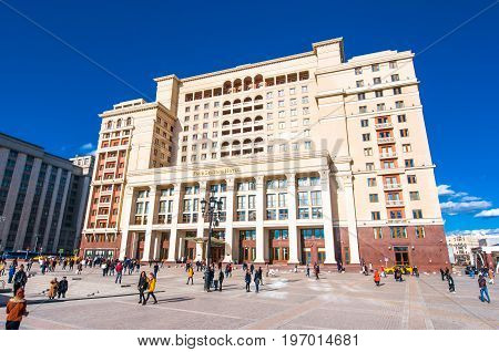 Moscow, Russia-march 23: Four Seasons Hotel On Manege Square During The Midday Tourists Go Sighseein