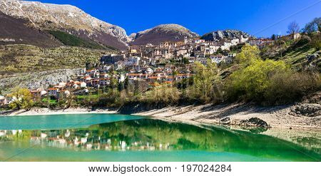 Beautiful lakes of Italy- turquoise Lago di Barrea and medieval village ,Abruzzo