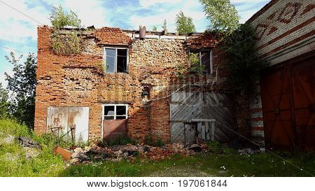 Ruins of brick building. Destroyed house without roof.