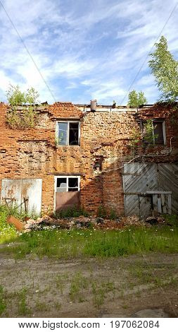 Ruins of brick building. Destroyed house without roof.
