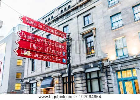 Montreal, Canada - May 27, 2017: Old Town Area With Closeup Of Red Direction Signs Street In Evening