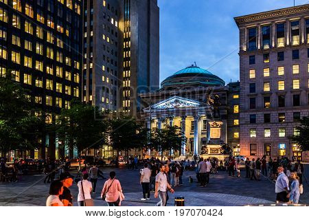 Montreal, Canada - May 27, 2017: Old Town Area With People Crossing Square At Night In Evening Outsi