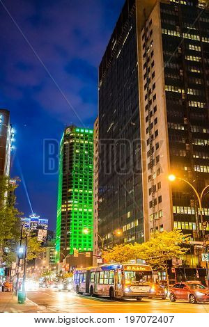 Montreal, Canada - May 27, 2017: Downtown Area With Traffic Cars And Complexe Desjardins Green Build