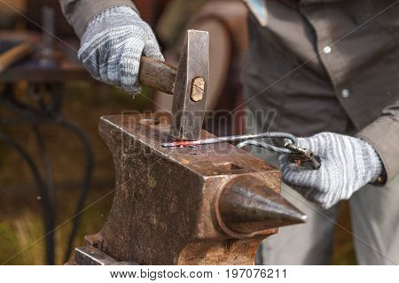 Blacksmith working on metal on anvil at forge high speed detail shot, blacksmith, blacksmithing,