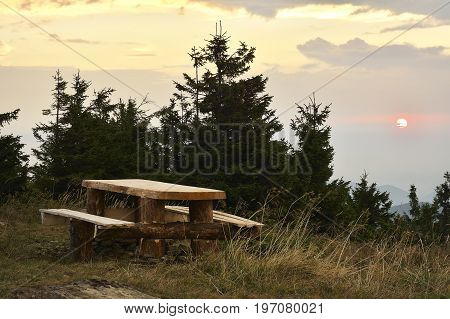 Sunrise In The Mountains And Wooden Table