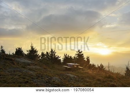 Sunrise In The Mountains And Wooden Table