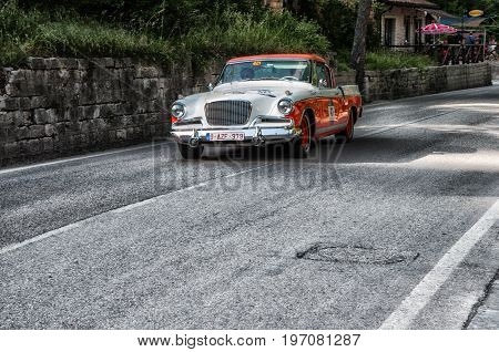 GOLA DEL FURLO, ITALY - MAY 19: STUDEBAKER GOLDEN HAWK 1956 on an old racing car in rally Mille Miglia 2017 the famous italian historical race (1927-1957) on May 19 2017