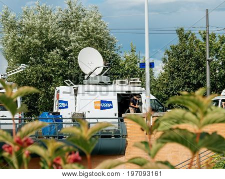 STRASBOURG FRANCE - JUN 30 2017: Viastoria Media Television Trucks with multiple Satellite parabolic antennas and fiber optic cables preparing to report live the official European Ceremony of Honour for Dr. Helmut Kohl at European Parliament