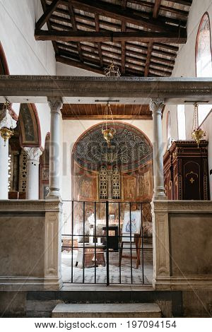 Rome Italy - August 18 2016: Interior view of church of Santa Maria in Cosmedin. The Mouth of Truth is a marble mask in Rome Italy which stands against the left wall of the portico of the Santa Maria in the Cosmedin church