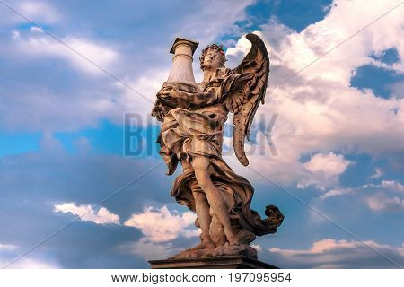 Marble statue of Angel with the Column at sunset, one of the ten angels on Saint Angel Bridge, symbols of Christ's Passion, Rome, Italy