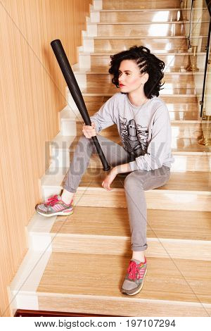Portrait of attractive brown-haired woman indoors