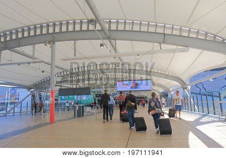 BRISBANE AUSTRALIA - JULY 8, 2017: Unidentified people travel at Brisbane airport train station Australia.