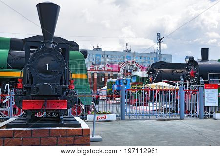 Novosibirsk Museum of railway equipment in Novosibirsk Siberia Russia - July 3 2017: the tank - engine of the German firm Borsig ( 19th century ) at the main entrance