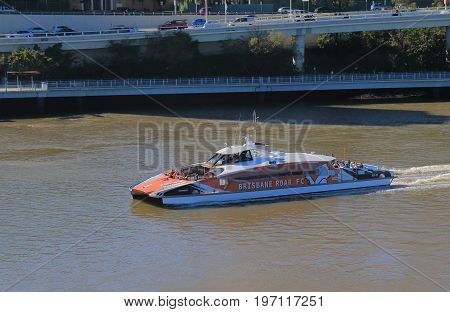 BRISBANE AUSTRALIA - JULY 8, 2017: Sightseeing cruise boat Citycat sails on Brisbane river in downtown Brisbane.