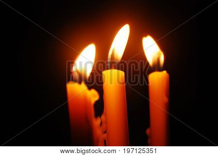 the candlelight is shining in the darkness