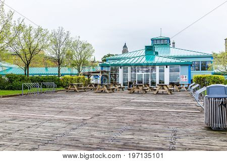 Quebec City, Canada - May 30, 2017: Picnic Seating Area By Old Port Market With Tables And View Of B