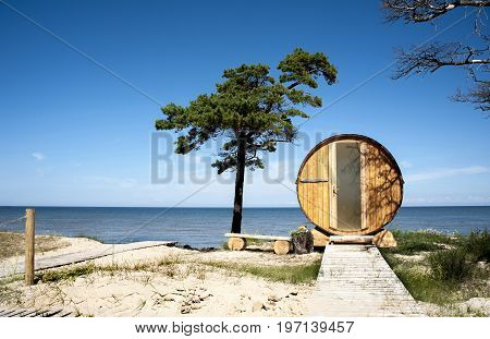 Europe Latvia Cape Kolka. House in the form of a barrel on the dunes for a double stay at the coast of the Baltic Sea. View from the door side.